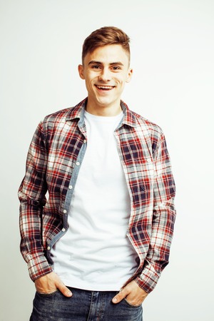 young handsome teenage hipster guy posing emotional, happy smiling against white background isolated, lifestyle people concept close upの写真素材