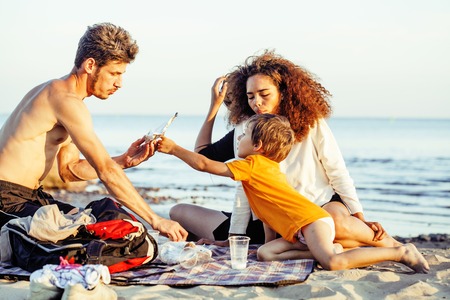 pretty diverse nation and age friends on sea coast having fun, lifestyle people concept on beach vacations close upの写真素材
