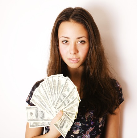 pretty young brunette real modern woman with money cash isolated on white background happy smiling, lifestyle people concept close upの写真素材