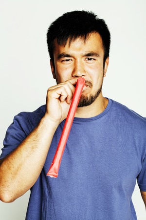 young cute asian man on white background gesturing emotional, posing lifestyle people concept close upの写真素材