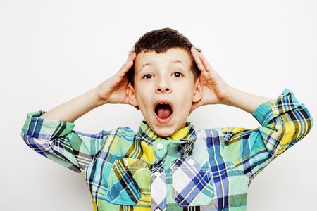 young pretty little boy kid wondering, posing emotional face isolated on white background, gesture...