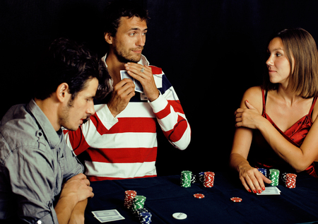 young people playing poker off-line tournament, friends party coの写真素材