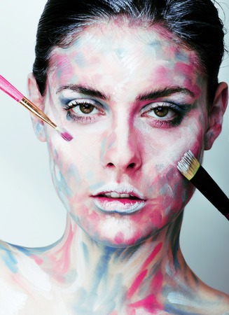 young woman with creative make up like painted oil picture on faの写真素材