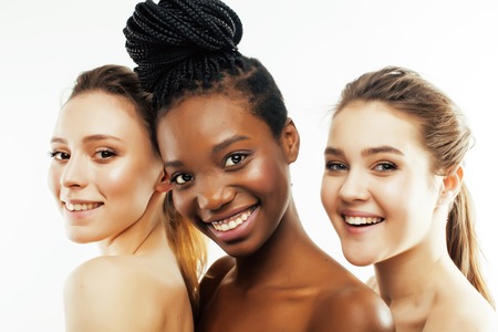 three different nation woman: african-american, caucasian together isolated on white background happy smiling, diverse type on skin, lifestyle people conceptの写真素材