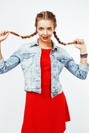 young pretty stylish hipster blond girl with pigtails posing emotional isolated on white background happy smiling cool smile, lifestyle people conceptの写真素材