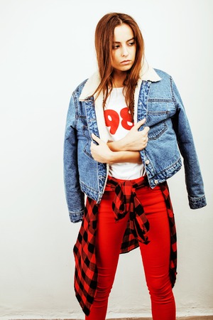 young pretty stylish hipster girl posing emotional isolated on white background happy smiling cool...