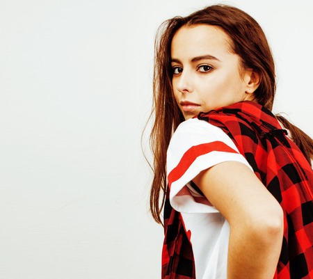 young pretty stylish hipster girl posing emotional isolated on white background happy smiling cool smile, lifestyle people conceptの写真素材