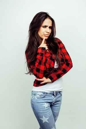 young happy smiling latin american teenage girl emotional posing on white background, lifestyle people conceptの写真素材