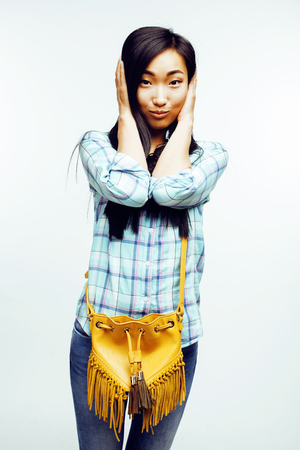 young pretty asian woman posing cheerful emotional isolated on white background, lifestyle people conceptの写真素材