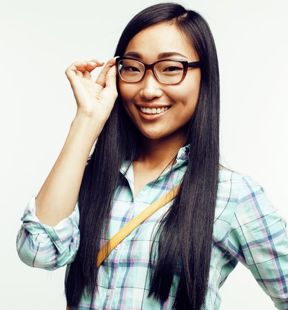 young pretty asian woman posing cheerful emotional isolated on white background, lifestyle people conceptの写真素材