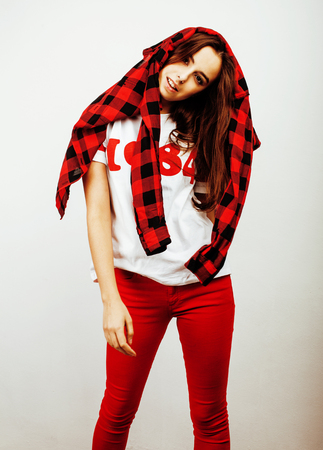 young pretty teenage hipster girl posing emotional happy smiling on white background, lifestyle people concept closeupの写真素材