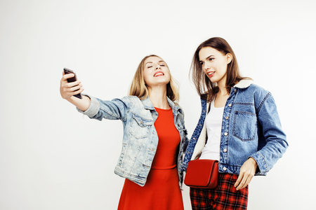 best friends teenage girls together having fun, posing emotional on white background, besties happy smiling, lifestyle people conceptの写真素材