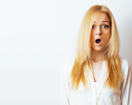 young blond woman on white backgroung gesture thumbs up, isolateの写真素材