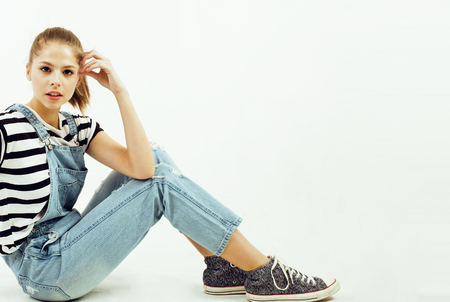 young pretty stylish brunette hipster girl posing emotional isolated on white background happy smiling cool smile, lifestyle people conceptの写真素材
