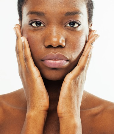 young pretty african american woman naked taking care of her skin isolated on white background, healthcare people conceptの写真素材