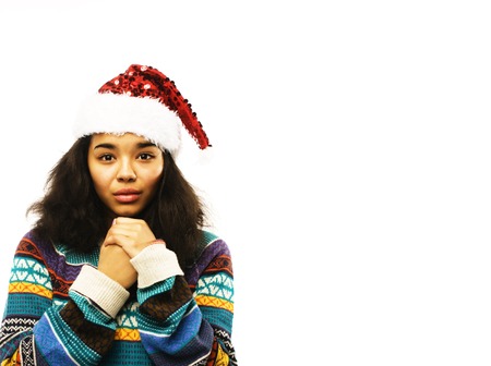 cute young girl in santas red hat isolatedの写真素材