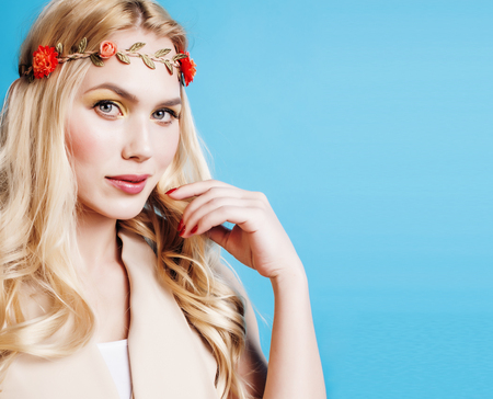 young blond woman dressed like ancient greek godess, gold jewelry close up isolated, beautiful girl hands manicuredの写真素材