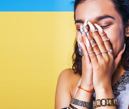 lifestyle people concept. young pretty smiling indian girl with long nails wearing lot of jewelry...
