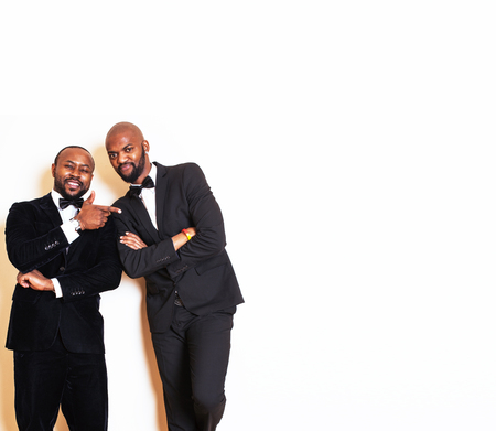 two afro-american businessmen in black suits emotional posing, g