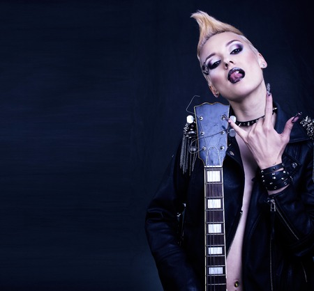 Fashion Rocker Style Model Girl Portrait. Hairstyle.Punk Woman Makeup, Hairdo and black Nails. Smoky Eyesの写真素材