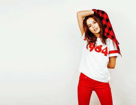 young pretty teenage hipster girl posing emotional happy smiling on white background, lifestyle people concept close upの写真素材