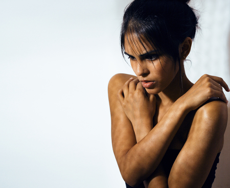 beauty latin young woman in depression, hopelessness look, fashiの写真素材