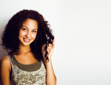 young pretty stylish hipster girl posing emotional isolated on wの写真素材