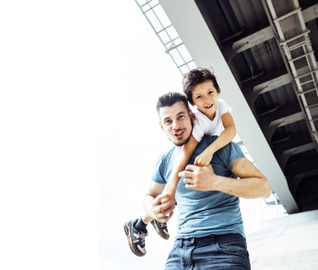 young pretty man model with little cute son playing together, liの写真素材