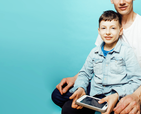 young pretty man model with little cute son playing together, liの写真素材