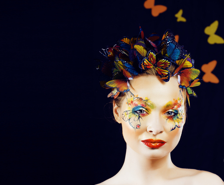 woman with summer creative make up like fairy butterfly closeup bright coloredの写真素材