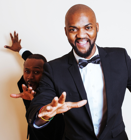 two afro-american businessmen in black suits emotional posing, gの写真素材