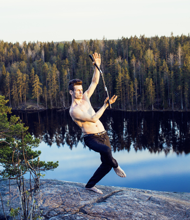 middle age man doing sport yoga on the top of the mountain, lifeの写真素材