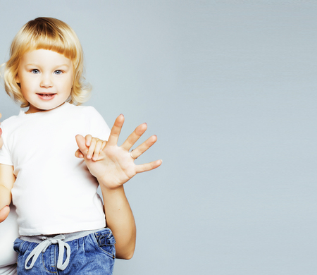 pretty real fashion mother with cute blond little daughterの写真素材