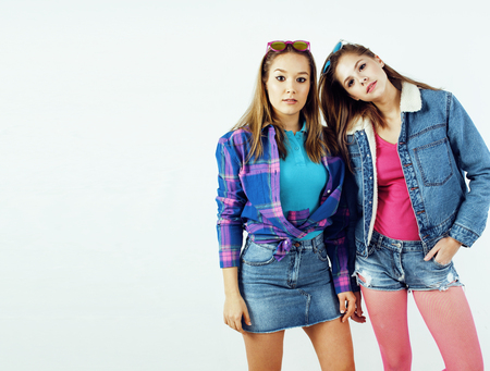 best friends teenage girls together having fun, posing emotional on white background, besties happy smiling, lifestyle people concept close up. making selfieの写真素材