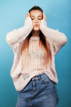 young pretty teenage modern hipster girl posing emotional happyの写真素材