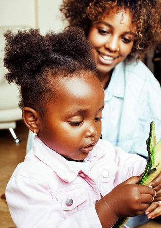 adorable sweet young afro-american mother with cute little daugh