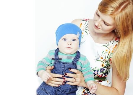 young beauty mother with cute baby, red head happy modern familyの写真素材