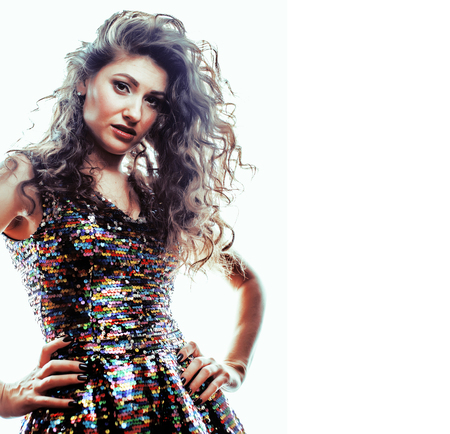 young brunette woman with curly hairstyle in fancy glamur dress