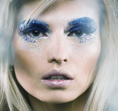beauty young snow queen lady in fairy flashes with hair crown onの写真素材
