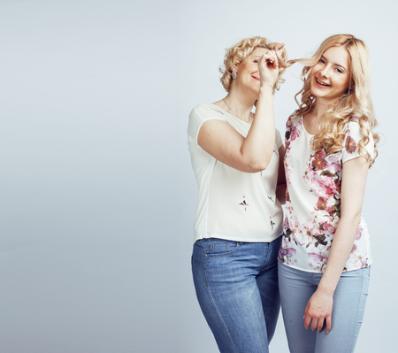 mother with daughter together posing happy smiling isolated on wの写真素材