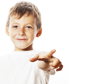 little cute boy pointing in studio isolated close upの写真素材