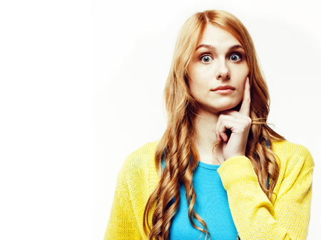 young pretty red hair woman happy smiling isolated on white backの写真素材