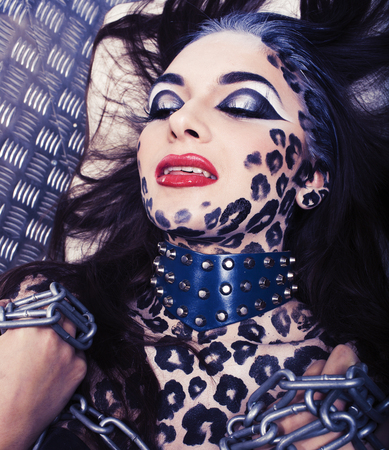 young sexy woman with leopard make up all over body, cat bodyartの写真素材