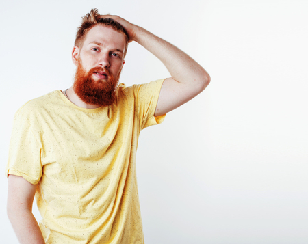 young handsome hipster ginger bearded guy looking brutal isolateの写真素材