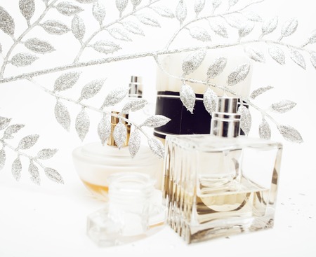Jewelry table with lot of girl stuff on it, little mess in cosmetic brushes, women interior concept, perfume elegance things isolated close upの写真素材