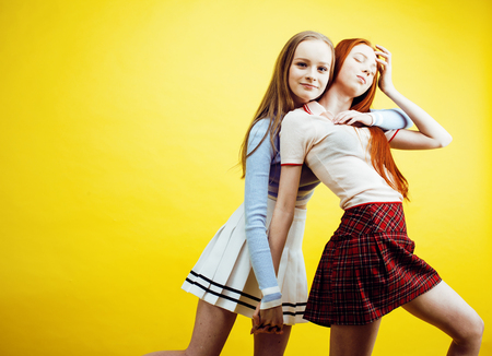 lifestyle people concept: two pretty young school teenage girlsの写真素材