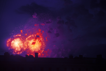 colorful bright fireworks on roof top silhouette, magic holiday