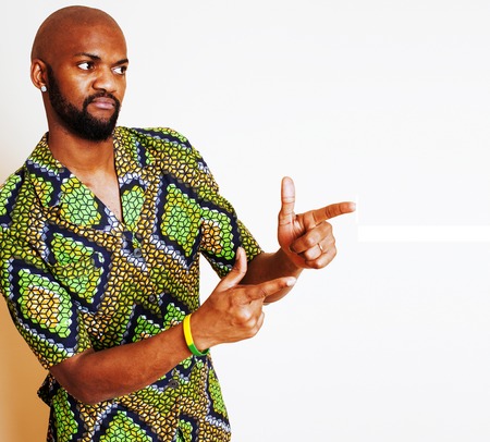 portrait of young handsome african man wearing bright green nati