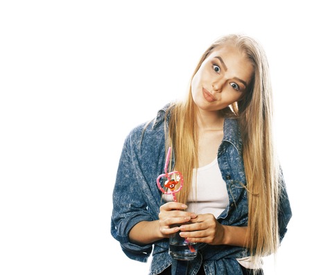 young blond woman on white backgroung gesture thumbs up, isolateの写真素材