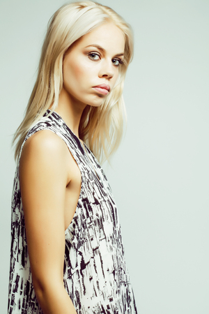 young pretty woman with blond hair on white backgroundの写真素材